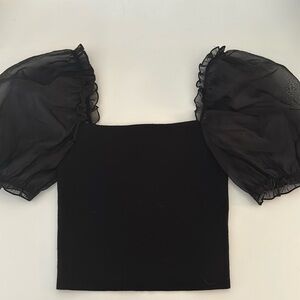 Black Aritzia top with puffer sleeves.